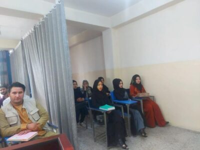 Taliban students separated by a curtain