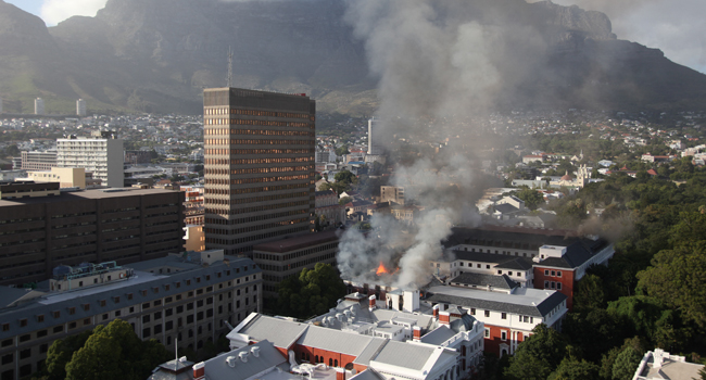 south-africa-parliament-fire-under-control,-suspect-charged